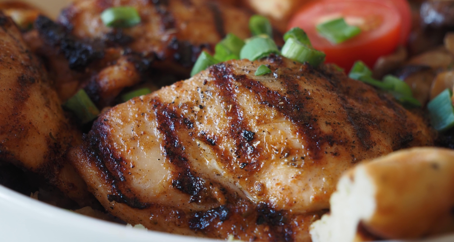 Close-up of tender grilled boneless chicken thighs