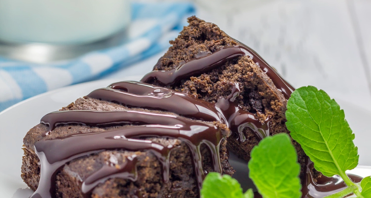 Rich and moist gluten-free chocolate cake topped with ganache.