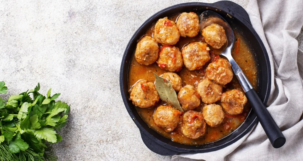 slow cooker tuscan chicken meatballs with gnocchi